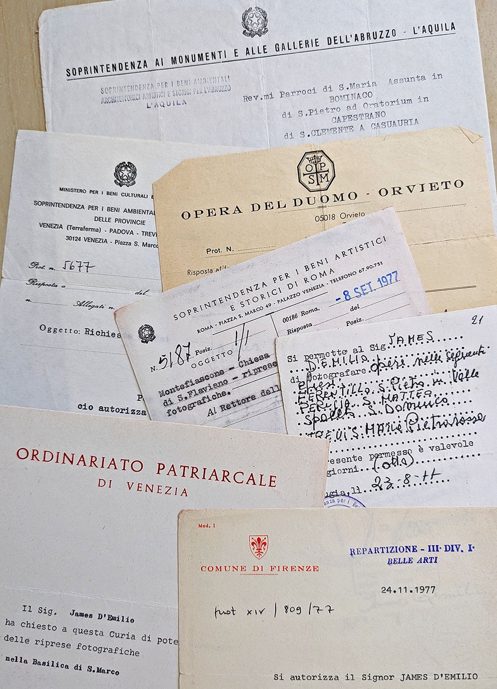 A collage of forms with emblems and letterheads of Italian civil and ecclesiastical authorities granting me permission to photograph monuments and works of art in various cities and provinces. Some are addressed to parish priests; some have the typed or handwritten names of specific monuments.