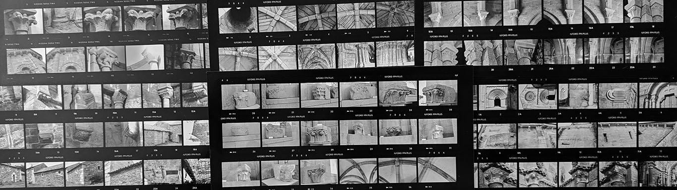 Several contact sheets show rows of black and white images, the size of 35 millimeter photographic negatives. Most are of capitals, vaults, and sections of walls.